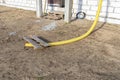 100mm diameter yellow PVC pipe connected to the end of the gutter on the roof, protected against water.