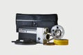Film camera 8mm with its bag , reels and film strips Royalty Free Stock Photo