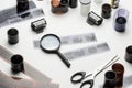 35mm films, magnifying glass and scissors on white background Royalty Free Stock Photo