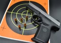 9mm Handgun Pistol with Bullets and Target Royalty Free Stock Photo