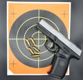 9mm Handgun Pistol with Bullets and Target Royalty Free Stock Photo