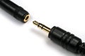 3.5 mm jack with a socket on a white background. Royalty Free Stock Photo