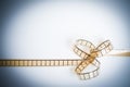 35mm movie filmstrip, film bow, copyspace vintage color look Royalty Free Stock Photo