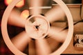 8mm movie projector playing at theater. White reel or can with tape film turning. Analog player. Retro old-fashioned Royalty Free Stock Photo