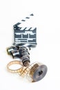 35mm movie reel with out of focus clapper in background Royalty Free Stock Photo
