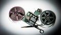 8mm movie reels, film on splicer ans scissors