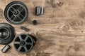 35 mm photo film and container for film development lying on wooden floor Royalty Free Stock Photo