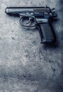 9 mm pistol gun and bullets strewn on the table Royalty Free Stock Photo