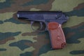 9mm russian handgun on russian camouflage uniform Royalty Free Stock Photo