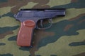 9mm russian handgun on russian camouflage uniform Royalty Free Stock Photo