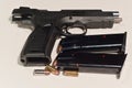 9MM, semi automatic hand gun, with sllide locked open and two-15 round magazines