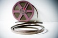 8mm super8 film detail with purple reel out of focus in background