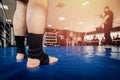 MMA fighter prepares to fight in ring, close-up legs in socks. Royalty Free Stock Photo