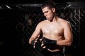 MMA Fighter wrapping his hands Royalty Free Stock Photo