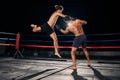 Mma, muay thai and fight with a boxing coach and training for health, fitness and sport exercise in a ring at the gym Royalty Free Stock Photo