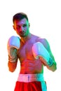 MMA. Portrait of sportsman, boxer, fighter workout against white background in mixed neon filter, light. Royalty Free Stock Photo