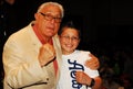 MMA Promoter Jimmy Burchfield, Sr. poses for a picture with a fan.