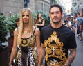 MMILAN, ITALY -JUNE 16, 2018: Soccer player Pato and girlfriend walking in the street after VERSACE fashion show