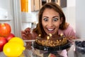 Mmmmm, yummy cake in front of a young womanÃ¢â¬â¢s face catching her eyes and taking over her senses