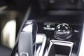 MMOSCOW, RUSSIA - MARCH 15, 2020: Close-up of the suspension control lever on the center panel in the interior of the Blue SUV