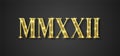 MMXXII 2022 roman number black backdrop gold text Royalty Free Stock Photo
