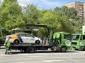 Moscow, Russia, June, 01, 2022. Carsharing car `Yandex Drive` was loaded onto a tow truck on the street of the Soviet Army in Mosc