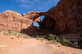 Moab, Utah - May 13, 2021: Happy hikers make their way back from the Double Arch in Arches National Park