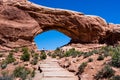 Visitors on a trail to the North Window Arch in the Windows section of Arches National Park