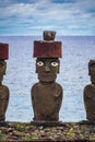 Moai with eyes in Easter Island against Pacific ocean