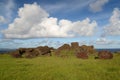 Moai statues and rocks under sky at Easter Island\'s Rano Kau crater Royalty Free Stock Photo