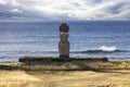 Moai with white eyes with sea in background