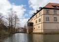 The historic Brake castle with a moat in the foreground.