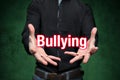 Mobbing, bullying, man holds lettering in the hands Royalty Free Stock Photo
