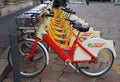 Milan, Italy - November 20, 2019: Mobike dockless bicycles parked in a street.