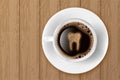 Cup of coffee with tooth on foam. Coffee spoils teeth and makes them yellow Royalty Free Stock Photo