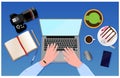 Workplace concept. Top view to hands with laptop, notebook, mouse, pencil, pen, mobile phone, digital camera, cup of coffee, cake