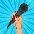 Girl or woman hand hold microphone cartoon vector illustration in pop art retro comic style Royalty Free Stock Photo