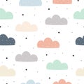 Hand-drawn background with pastel clouds on a white sky Cute seamless patterns