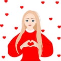 Pretty romantic young blond woman making a heart gesture with her fingers