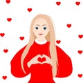 Pretty romantic young blond woman making a heart gesture with her fingers in front of her chest