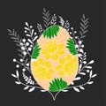 Bright Easter egg with floral decoration on the dark background with white branches. Royalty Free Stock Photo