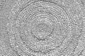 Grunge texture of an ethnic circular hand-knitted rug