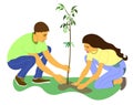 man and woman are planting tree. The couple plants seedling. girl helps man plant young tree.