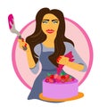 girl in an apron. pastry chef holds pink birthday cake with berries. The girl decorates delicious cake with pastry bag Royalty Free Stock Photo