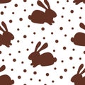 Simple vector seamless polka dot pattern. Chocolate bunny on a white background. For prints of fabrics, textile products.