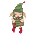 Little elf with toys as a gift. Isolated. Santa\'s helper holds candies