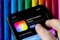 Mobile Adobe creative cloud app on appStore with a colorful plasticine background. Royalty Free Stock Photo