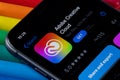 Mobile Adobe creative cloud app on appStore with a colorful plasticine background. Royalty Free Stock Photo