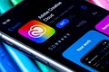 Mobile Adobe creative cloud app on appStore with a colorful plasticine background. Royalty Free Stock Photo