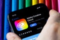 Mobile Adobe creative cloud app on appStore with a colorful plasticine background. Royalty Free Stock Photo
